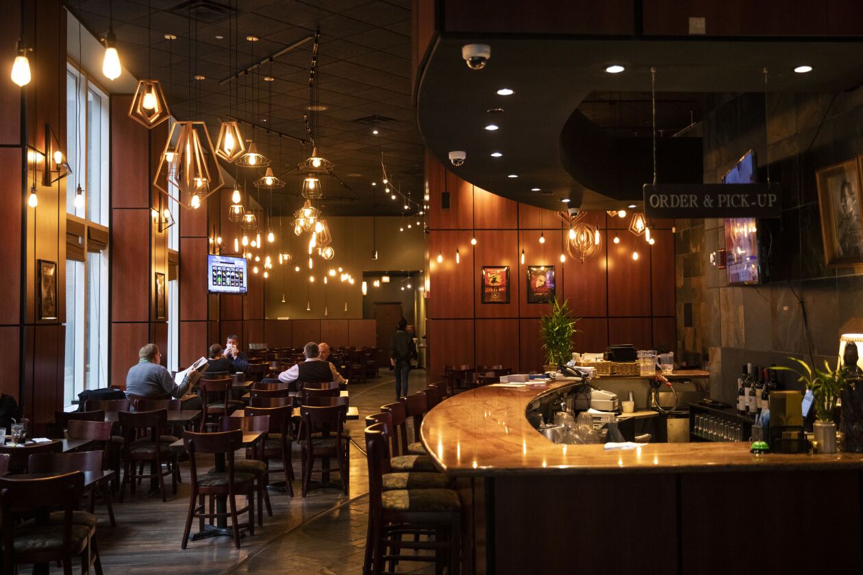 A handful of customers eat in the dining room at Siam Rice, 117 N. Wells St. last March, shortly before Gov. J.B. Pritzker issued his stay-at-home order.